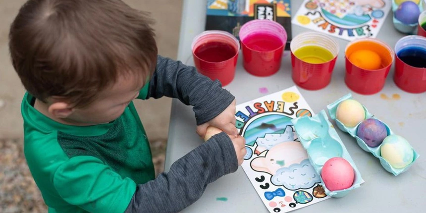 A boy coloring easter eggs and other arts & crafts.