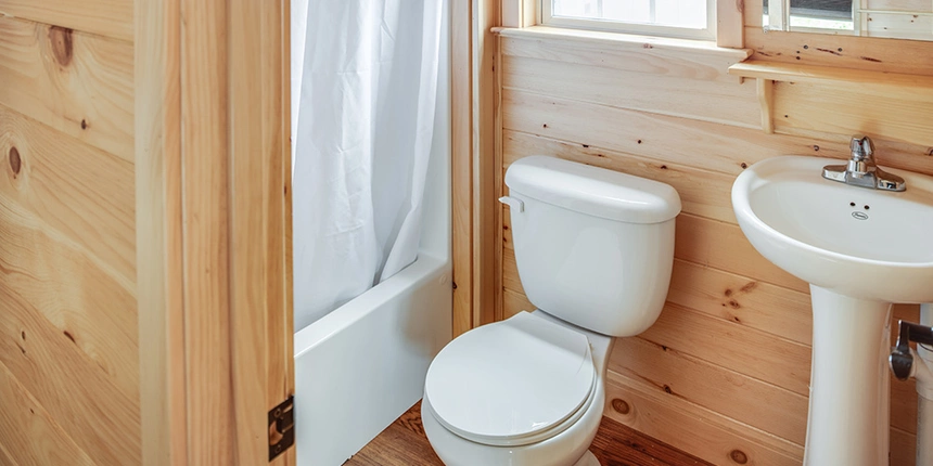 Enjoy your own bathroom while cabin camping in New York. 