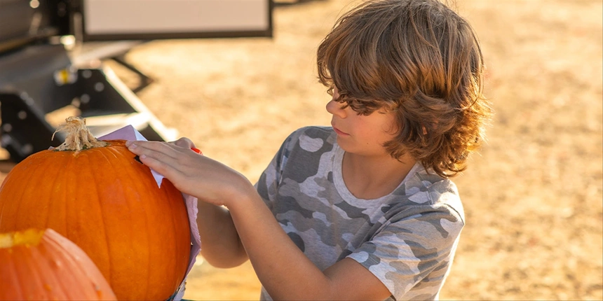 Camper with pumpkin