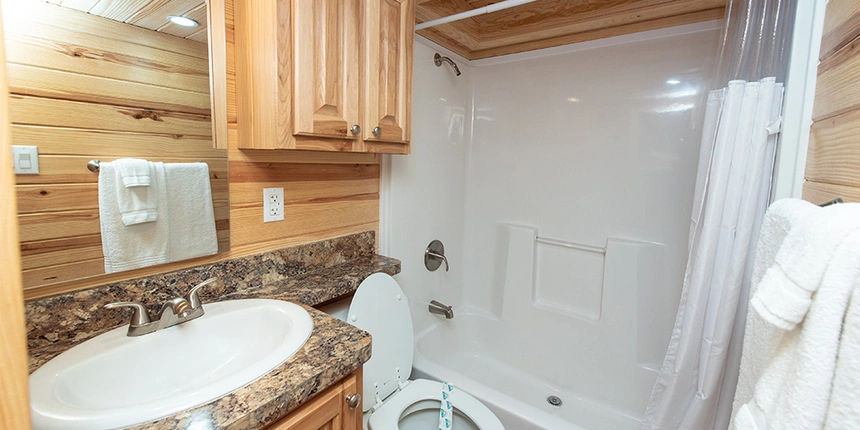 Full bathroom featuring a bathtub, toilet, sink, and more.