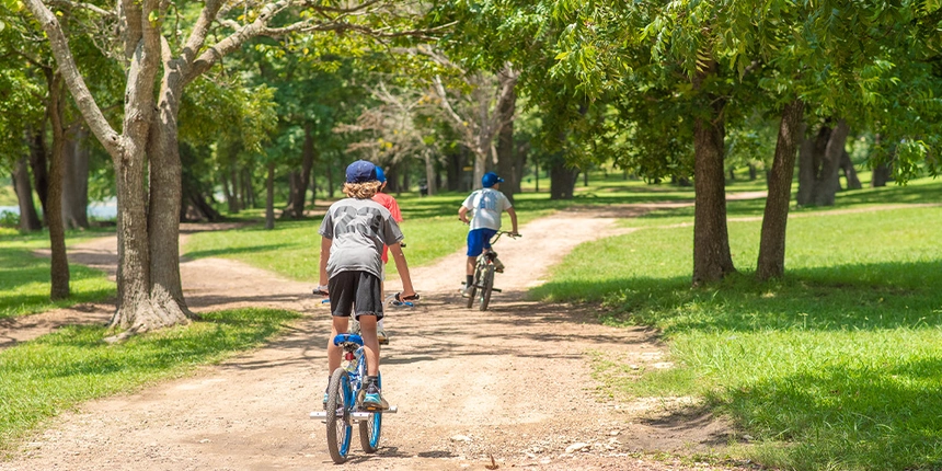 Kids riding their bikes on one of our paths at the Camp-Resort!