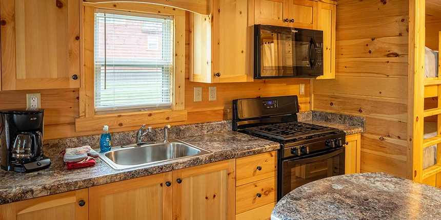 Have access to a full kitchens in these Jellystone Park cabins. 