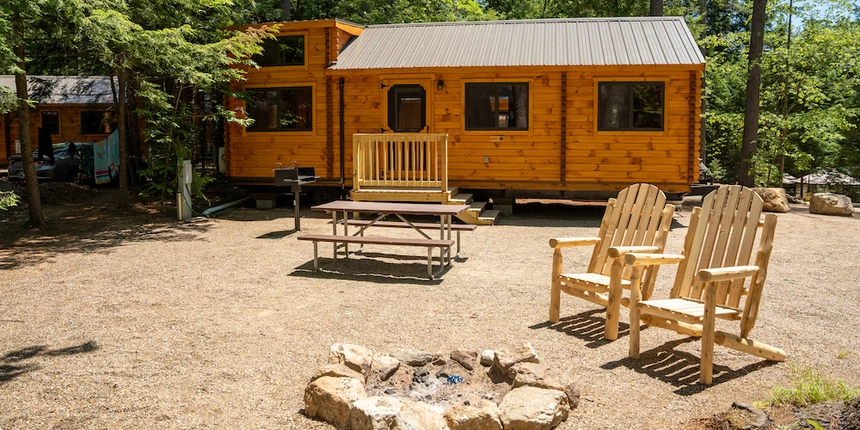 Lounge outside or around the fire when you choose cabin camping at our New Hampshire camping resort.