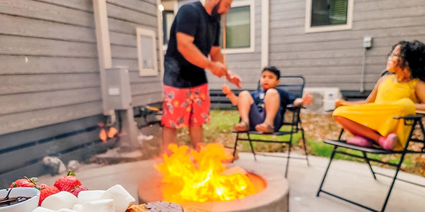 Camp fire with kids on chairs. 