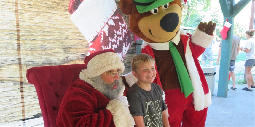 Santa with Yogi Bear™ and a camper!