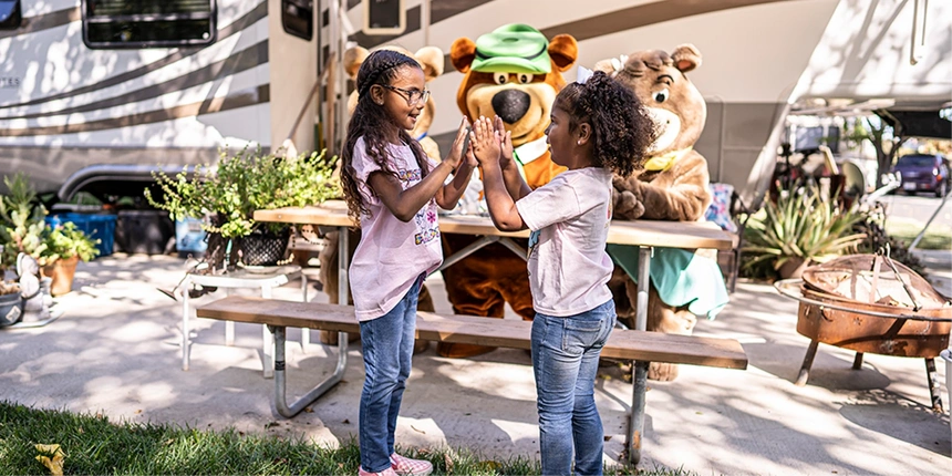 Campers and bears having fun at the campsite.