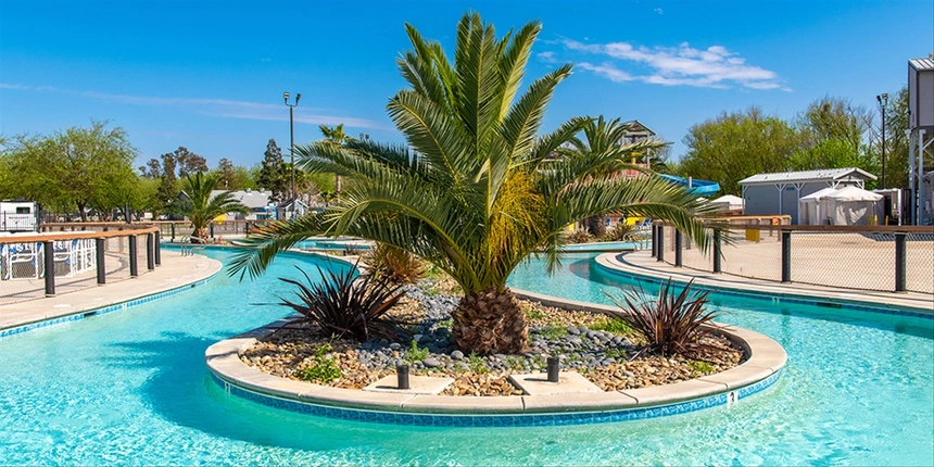 View of the Lazy River with water park in the back. 