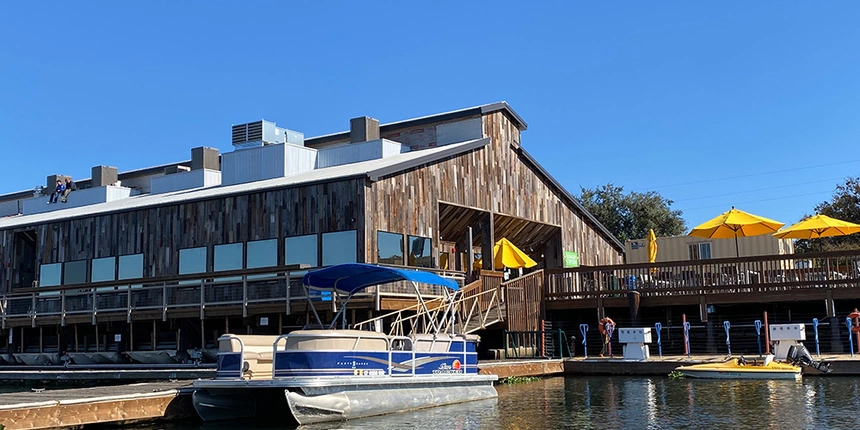 The exterior of the Waterfront Grille including the building and the deck.