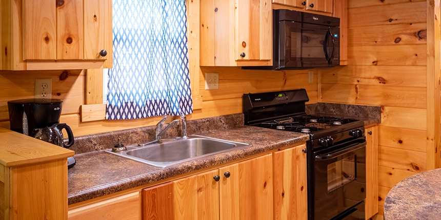 Have access to a full kitchens in these Jellystone Park cabins. 