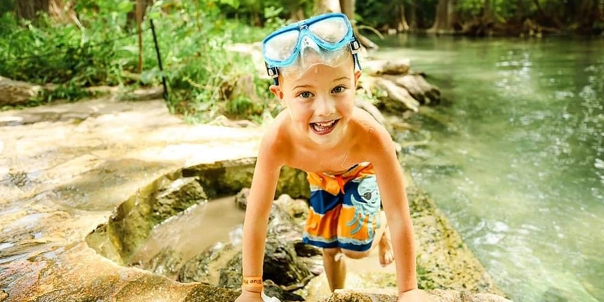 Boy playing at blue hole ridge