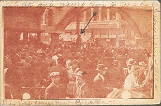 Silhouetted corpse of African American Allen Brooks hanging from Elk's Arch, surrounded by spectators. March 3, 1910. Dallas, Texas.