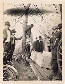 John Richards hanging on a tree, jubilant lynchers, a freshly hewn pine coffin. January 12, 1916, Goldsboro, North Carolina.