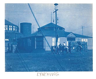 Unidentified lynching, onlookers on horseback.