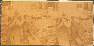 Stereograph of the burnt and partially skinned corpses of Ami "Whit" Ketchum and Luther H. Mitchell. December 10, 1878, Calloway, Custer County, Nebraska.
