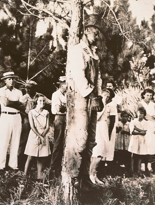 
The lynching of Rubin Stacy. Onlookers, including four young girls.