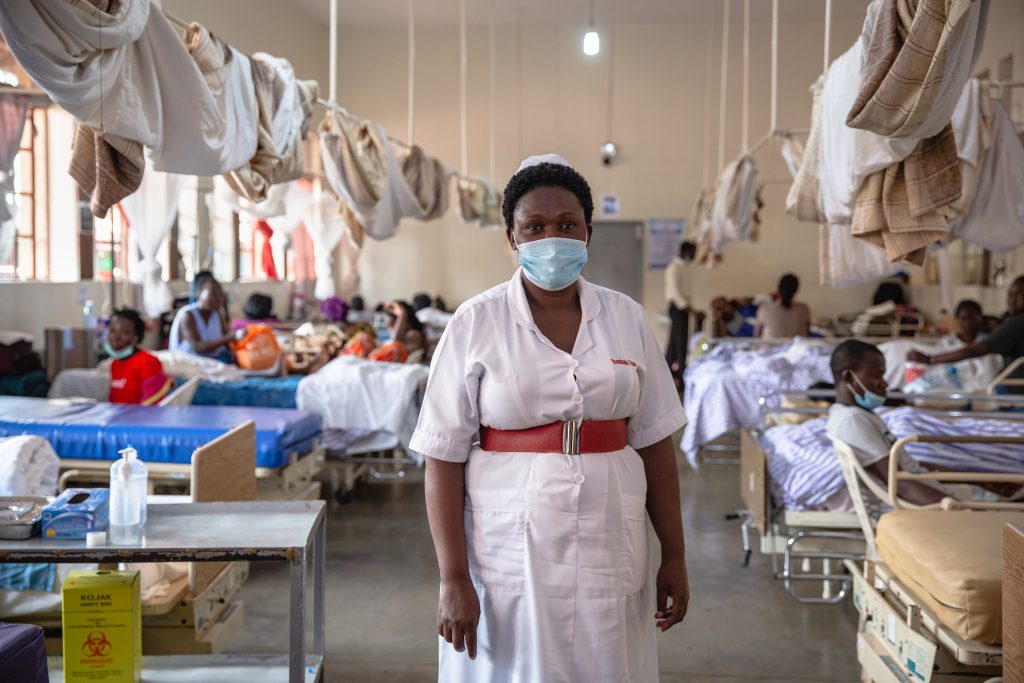 A midwife stands in a delivery room
