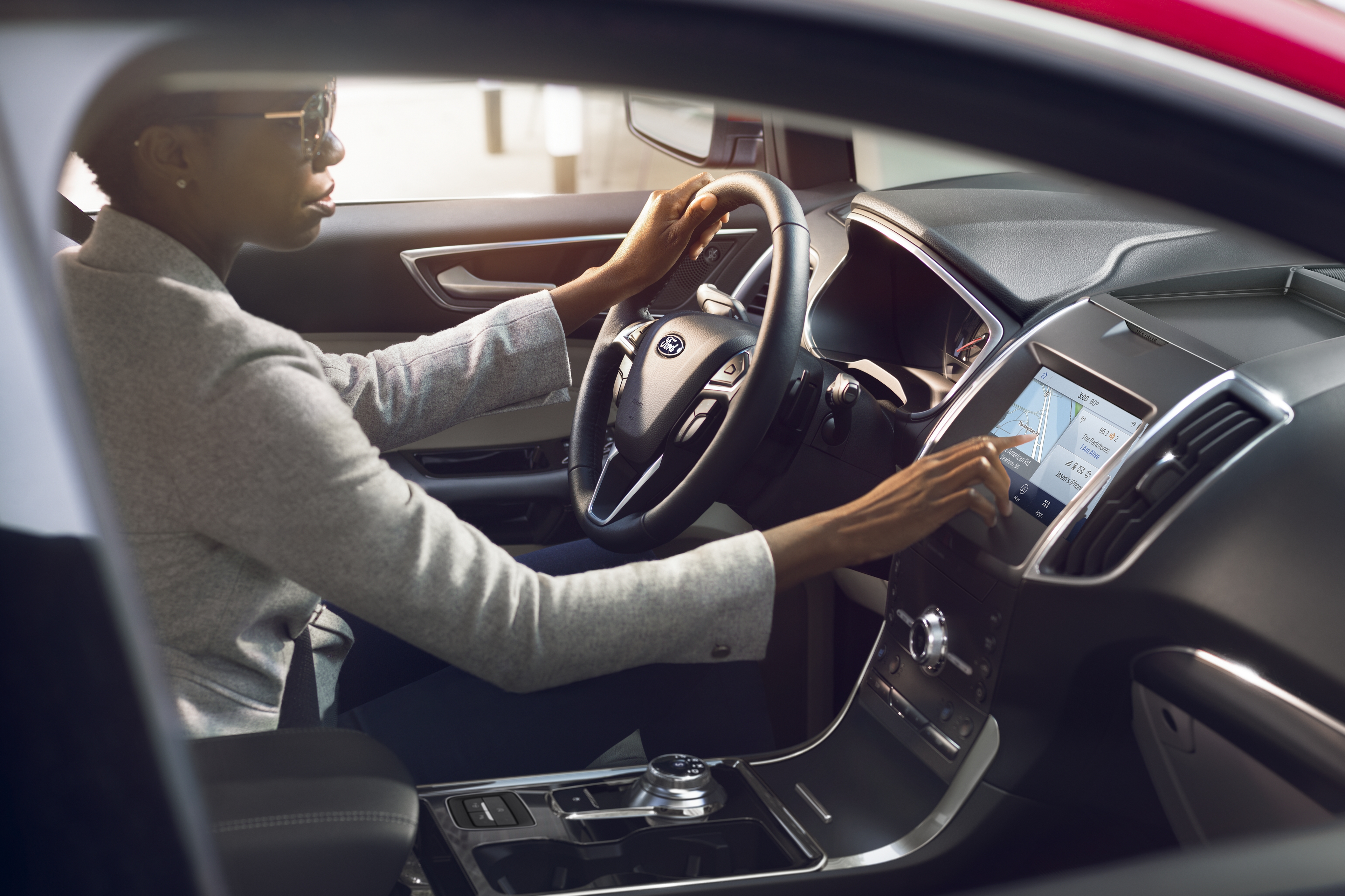 person interacting with the headunit of a 2020 ford explorer