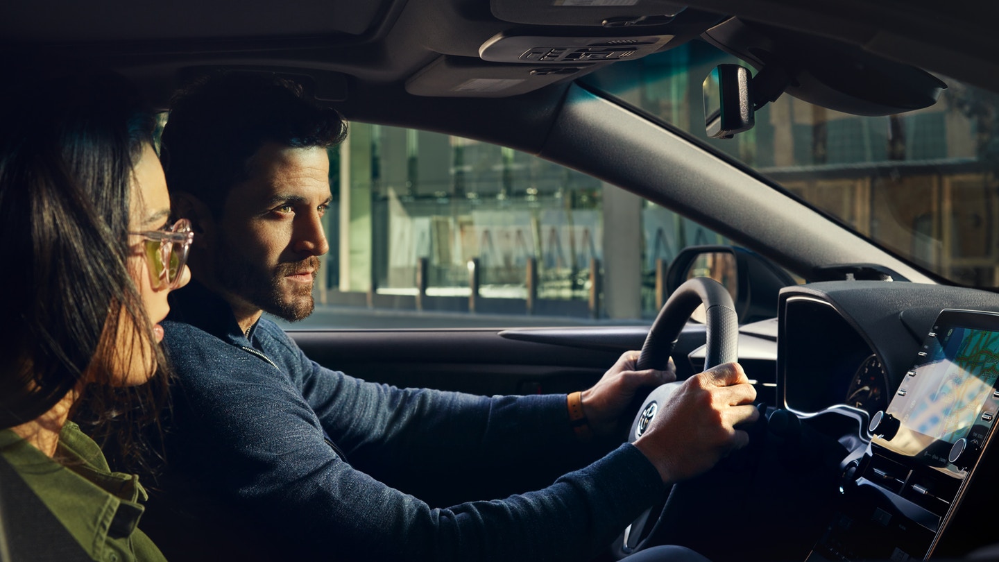 Couple driving 2019 Toyota Avalon