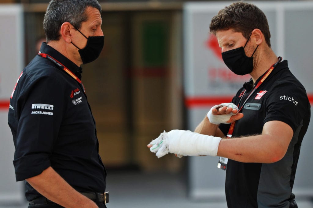 (L to R): Guenther Steiner Haas F1 Team Principal with Romain Grosjean © XPB Images