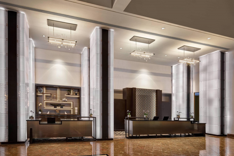 Reception area with standing desks and a lowered desk.
