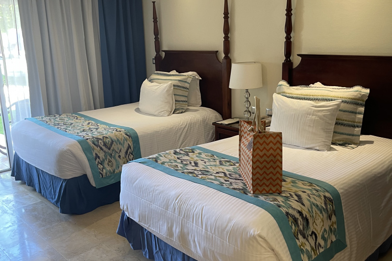 Bedroom with twin beds and wide space around the beds.