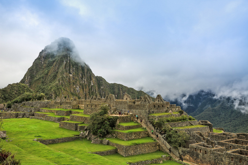 People exploring Machu Picchu ruins