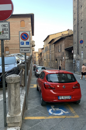 Accessible parking spaces on small street with paved roads.