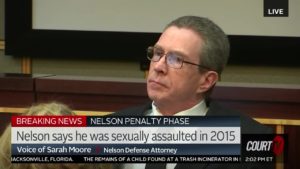 Scott Nelson sits in court