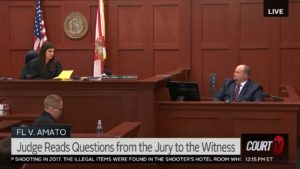 A judge speaks to the witness in court