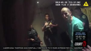 a man is seen surrounded by police on bodycam video