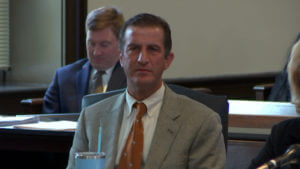 Michael Colucci listens to testimony in his murder trial