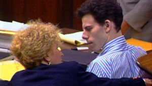 Erik Menendez speaks to Leslie Abramson during his trial
