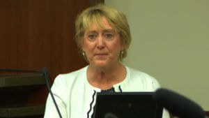 a woman testifies in court