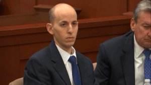 Grant Amato listens in court during his triple murder trial