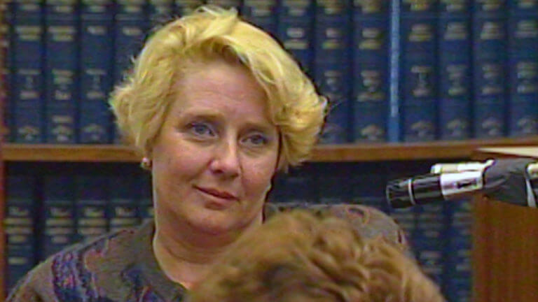 Betty Broderick smirks at the camera