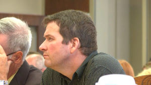 Todd Mullis sits in court
