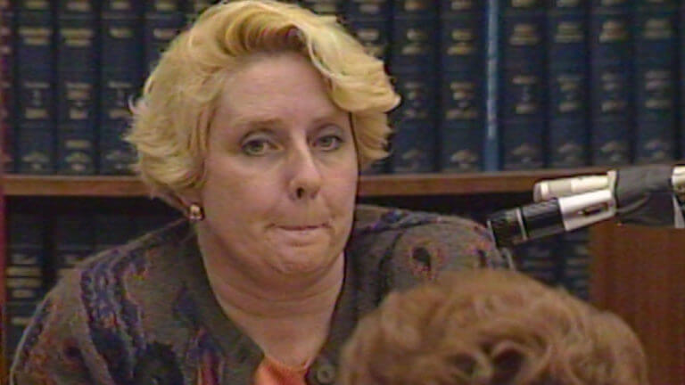 Betty Broderick purses her lips while testifying.