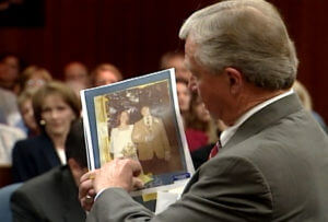attorney points to a photograph