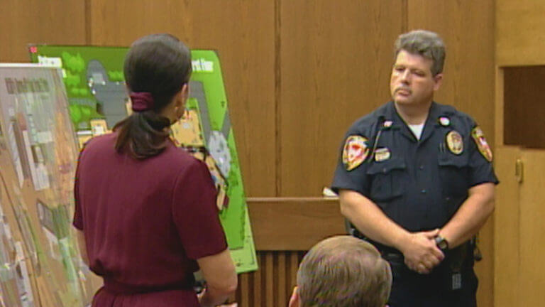 a woman and a police officer approach diagram in court