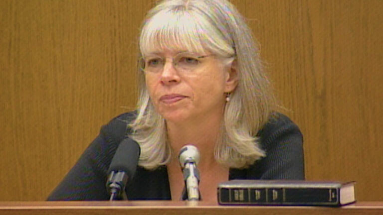 A woman testifies in court