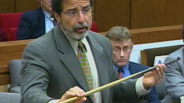 An attorney shows evidence to the jury.