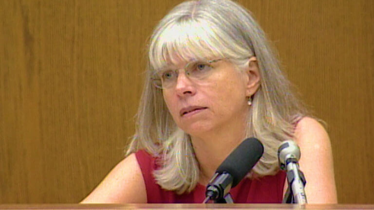 A woman testifies in court