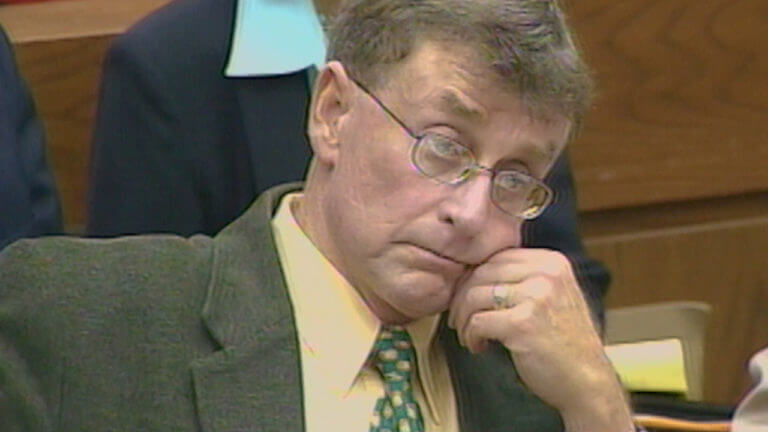 Michael Peterson listens to the testimony of Agent Deaver in his murder trial