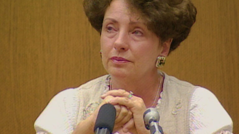 A woman testifies in court