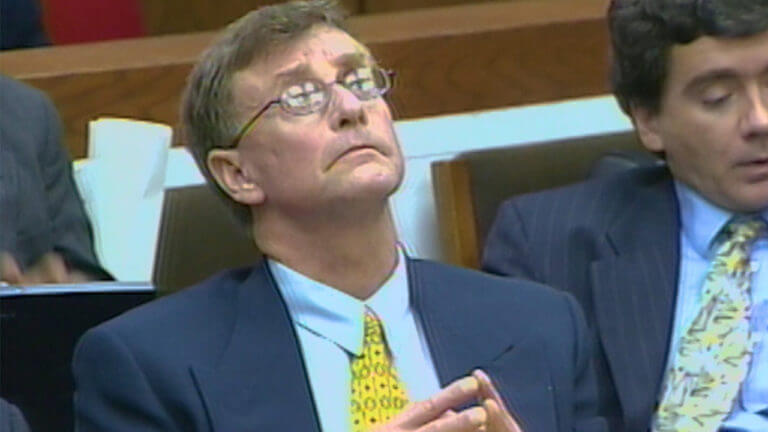 Michael Peterson leans back in court