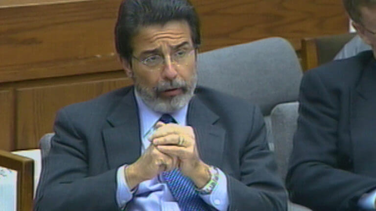 An attorney sits during a trial