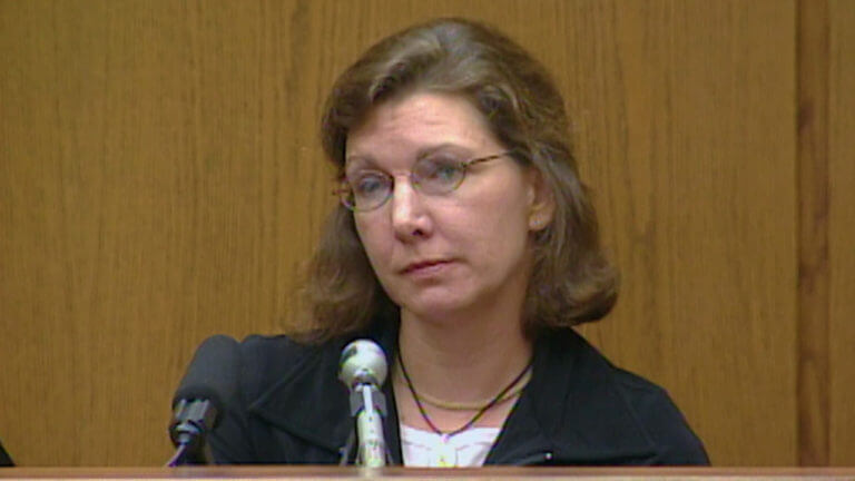 A woman testifies in court