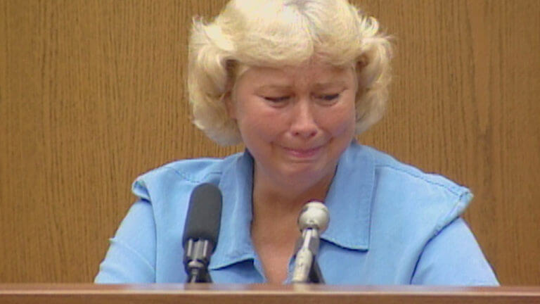 A woman cries while testifying in court