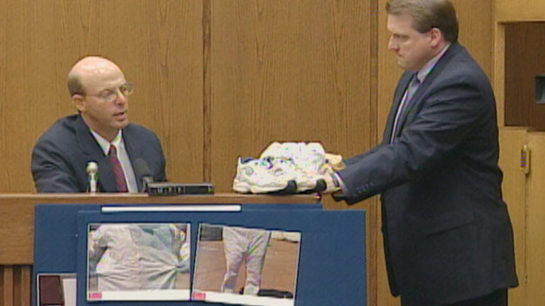 Two men show evidence to the jury