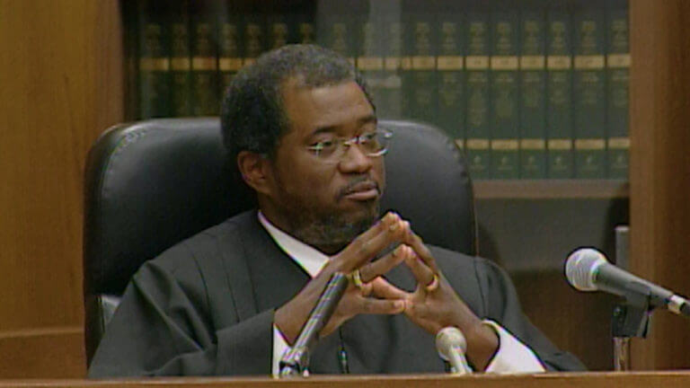 a judge presides over a courtroom